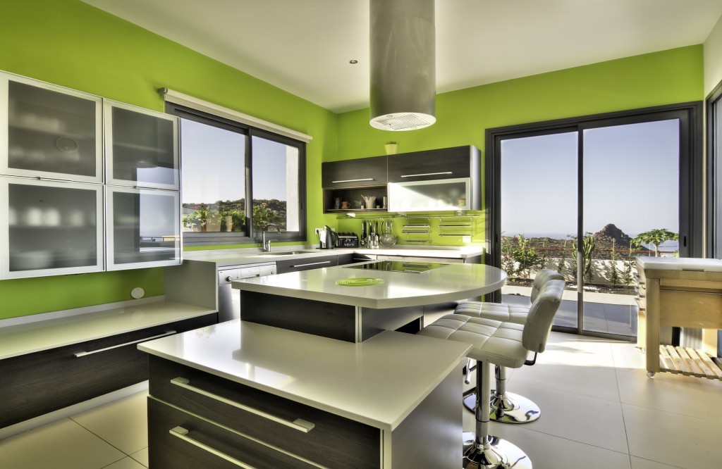 Modern green kitchen with ocean view