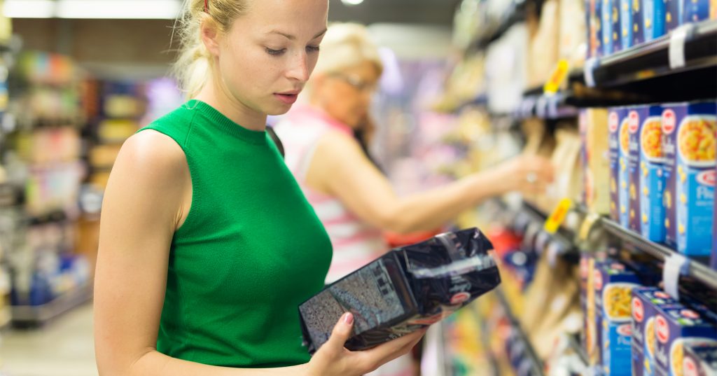 Beautiful caucasian woman shopping cleaners at supermarket.